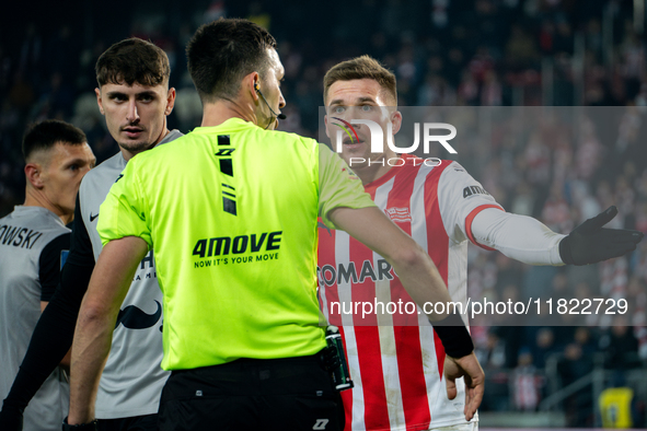 Benjamin Kallman argues with referee Damian Kos during the game between KS Cracovia and Zaglebie Lubin in Krakow, Poland, on November 29, 20...