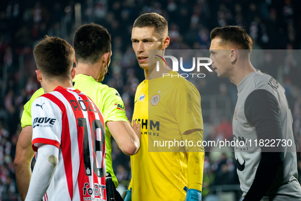 Zaglebie goalkeeper Dominik Hladun argues with referee Damian Kos during the game between KS Cracovia and Zaglebie Lubin in Krakow, Poland,...