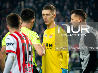 Zaglebie goalkeeper Dominik Hladun argues with referee Damian Kos during the game between KS Cracovia and Zaglebie Lubin in Krakow, Poland,...