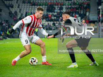 Benjamin Kallman and Jaroslaw Jach participate in the game between KS Cracovia and Zaglebie Lubin in Krakow, Poland, on November 29, 2024. T...