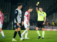 Referee Damian Kos shows a yellow card to Jakub Jugas during the game between KS Cracovia and Zaglebie Lubin in Krakow, Poland, on November...