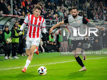 Filip Rozga and Mateusz Wdowiak participate in the game between KS Cracovia and Zaglebie Lubin in Krakow, Poland, on November 29, 2024. This...