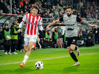 Filip Rozga and Mateusz Wdowiak participate in the game between KS Cracovia and Zaglebie Lubin in Krakow, Poland, on November 29, 2024. This...