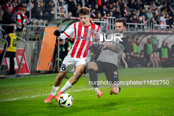 Filip Rozga and Mateusz Wdowiak participate in the game between KS Cracovia and Zaglebie Lubin in Krakow, Poland, on November 29, 2024. This...