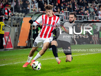 Filip Rozga and Mateusz Wdowiak participate in the game between KS Cracovia and Zaglebie Lubin in Krakow, Poland, on November 29, 2024. This...