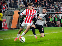 Filip Rozga and Mateusz Wdowiak participate in the game between KS Cracovia and Zaglebie Lubin in Krakow, Poland, on November 29, 2024. This...