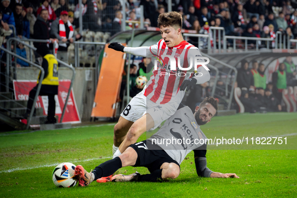 Filip Rozga and Mateusz Wdowiak participate in the game between KS Cracovia and Zaglebie Lubin in Krakow, Poland, on November 29, 2024. This...