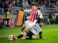 Filip Rozga and Mateusz Wdowiak participate in the game between KS Cracovia and Zaglebie Lubin in Krakow, Poland, on November 29, 2024. This...