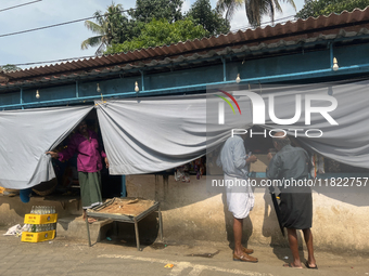 Shops hang cloth sheets to protect from the strong sun and intense heat in Konni, Pathanamthitta, Kerala, India, on April 5, 2024. (