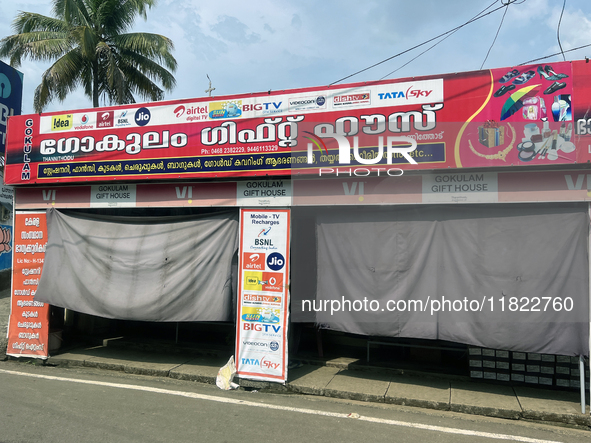 Shops hang cloth sheets to protect from the strong sun and intense heat in Konni, Pathanamthitta, Kerala, India, on April 5, 2024. 