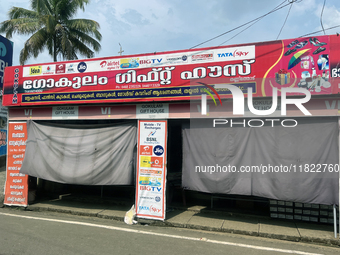 Shops hang cloth sheets to protect from the strong sun and intense heat in Konni, Pathanamthitta, Kerala, India, on April 5, 2024. (