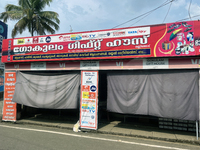 Shops hang cloth sheets to protect from the strong sun and intense heat in Konni, Pathanamthitta, Kerala, India, on April 5, 2024. (