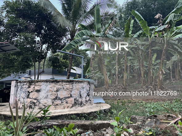 A well stands by banana trees in front of a home in Konni, Pathanamthitta, Kerala, India, on April 5, 2024. 