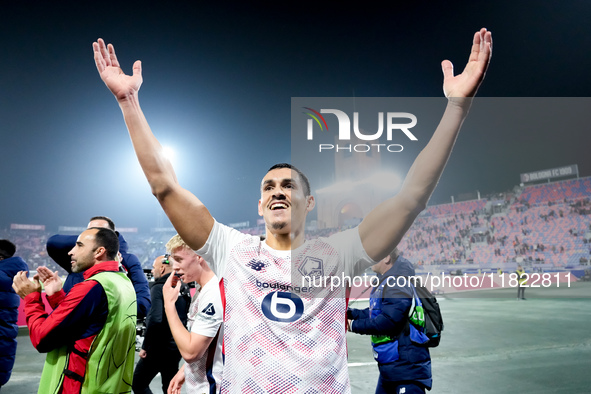 Aissa Mandi of LOSC Lille celebrates the victory at the end of the UEFA Champions League 2024/25 League Phase MD5 match between Bologna FC a...