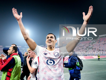 Aissa Mandi of LOSC Lille celebrates the victory at the end of the UEFA Champions League 2024/25 League Phase MD5 match between Bologna FC a...