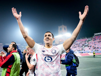 Aissa Mandi of LOSC Lille celebrates the victory at the end of the UEFA Champions League 2024/25 League Phase MD5 match between Bologna FC a...