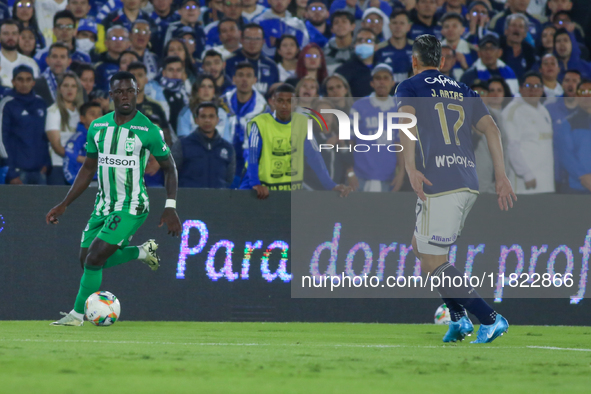 Jorge Arias of Millonarios and Marino Hinestroza of Atletico Nacional fight for the ball during the match on the third date of the semifinal...