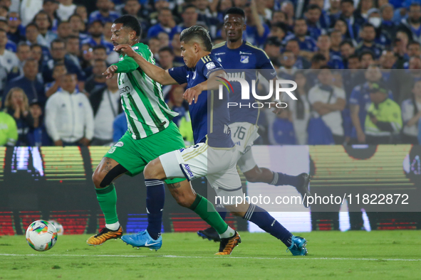 Jorge Arias of Millonarios F.C. and Edwin Cardona of Atletico Nacional fight for the ball during the match on the 3rd date of the semifinal...