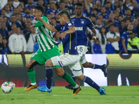 Jorge Arias of Millonarios F.C. and Edwin Cardona of Atletico Nacional fight for the ball during the match on the 3rd date of the semifinal...