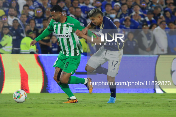 Jorge Arias of Millonarios F.C. and Edwin Cardona of Atletico Nacional fight for the ball during the match on the 3rd date of the semifinal...