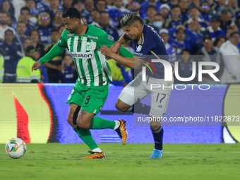 Jorge Arias of Millonarios F.C. and Edwin Cardona of Atletico Nacional fight for the ball during the match on the 3rd date of the semifinal...