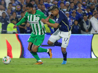 Jorge Arias of Millonarios F.C. and Edwin Cardona of Atletico Nacional fight for the ball during the match on the 3rd date of the semifinal...