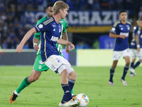 Andres Llinas of Millonarios F.C. and Edwin Cardona of Atletico Nacional fight for the ball during the match on the 3rd date of the semifina...