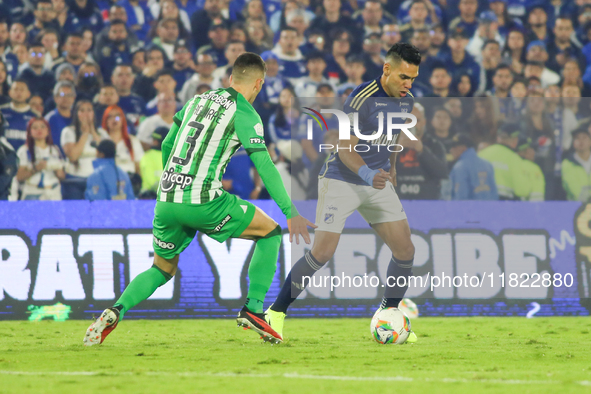 Radamel Falcao Garcia of Millonarios and Felipe Aguirre of Atletico Nacional fight for the ball during the match on the third date of the se...