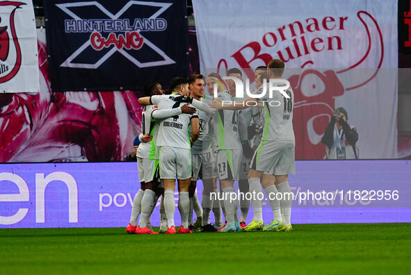 Mohamed Amoura of VfL Wolfsburg  celebrates the teams first goal during the Bundesliga match between RB Leipzig and VfL Wolfsburg at Red Bul...