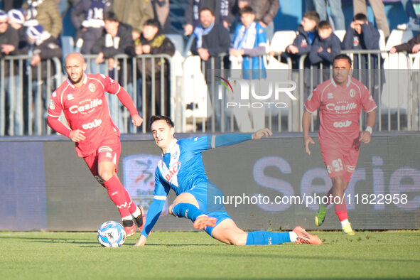 Massimo Bertagnoli of Brescia Calcio FC tackles during the Italian Serie B soccer championship match between Brescia Calcio and SSC Bari at...