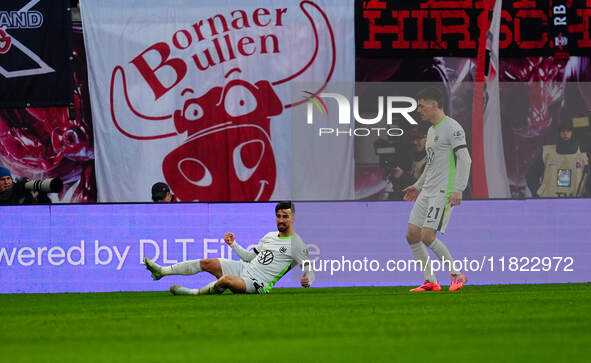 Mohamed Amoura of VfL Wolfsburg  celebrates the teams first goal during the Bundesliga match between RB Leipzig and VfL Wolfsburg at Red Bul...