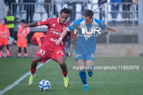 Mehdi Dorval of SSC Bari contrasts with Fabrizio Paghera of Brescia Calcio FC during the Italian Serie B soccer championship match between B...