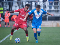 Mehdi Dorval of SSC Bari contrasts with Fabrizio Paghera of Brescia Calcio FC during the Italian Serie B soccer championship match between B...