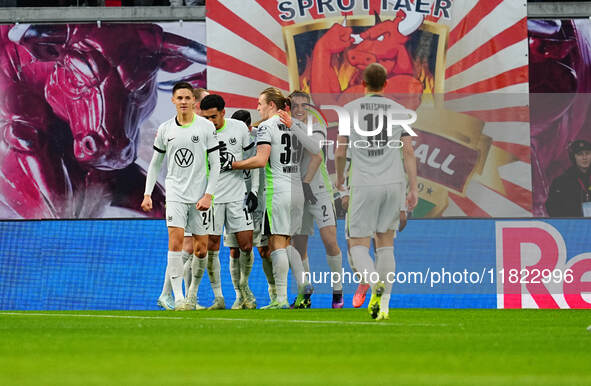 Mohamed Amoura of VfL Wolfsburg  celebrates the teams third goal during the Bundesliga match between RB Leipzig and VfL Wolfsburg at Red Bul...