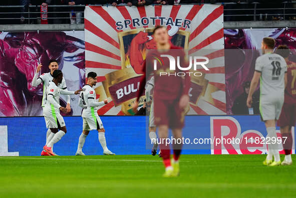 Mohamed Amoura of VfL Wolfsburg  celebrates the teams third goal during the Bundesliga match between RB Leipzig and VfL Wolfsburg at Red Bul...