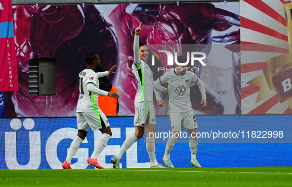 Mohamed Amoura of VfL Wolfsburg  celebrates the teams third goal during the Bundesliga match between RB Leipzig and VfL Wolfsburg at Red Bul...