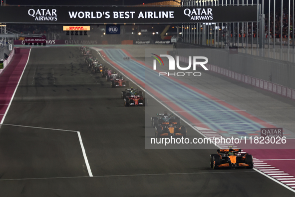 Lando Norris, Oscar Piastri of McLaren and George Russell of Mercedes during Sprint ahead of the Formula 1 Grand Prix of Qatar at Lusail Int...