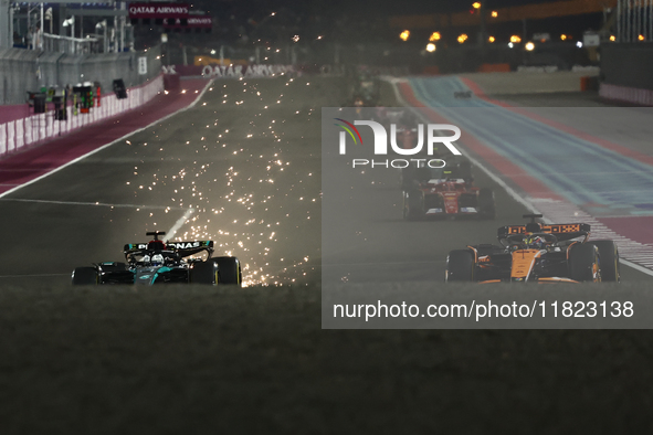 George Russell of Mercedes and Oscar Piastri of McLaren during Sprint ahead of the Formula 1 Grand Prix of Qatar at Lusail International Cir...