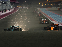 George Russell of Mercedes and Oscar Piastri of McLaren during Sprint ahead of the Formula 1 Grand Prix of Qatar at Lusail International Cir...