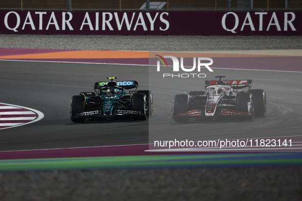 Kevin Magnussen of Haas and Fernando Alonso of Aston Martin Aramco during Sprint ahead of the Formula 1 Grand Prix of Qatar at Lusail Intern...