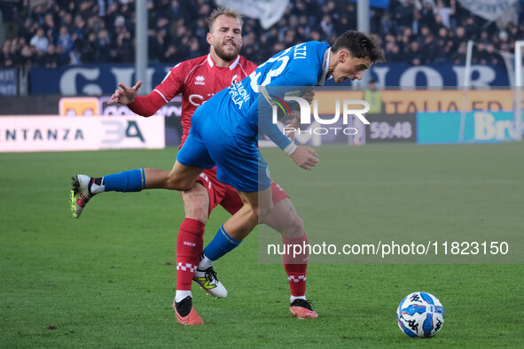 Nicolas Galazzi of Brescia Calcio FC is contrasted by Giuseppe Sibilli of SSC Bari during the Italian Serie B soccer championship match betw...