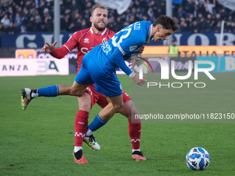 Nicolas Galazzi of Brescia Calcio FC is contrasted by Giuseppe Sibilli of SSC Bari during the Italian Serie B soccer championship match betw...