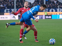 Nicolas Galazzi of Brescia Calcio FC is contrasted by Giuseppe Sibilli of SSC Bari during the Italian Serie B soccer championship match betw...