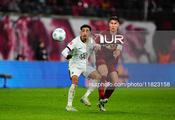 Tiago Tomas of VfL Wolfsburg and Willi Orban of RB Leipzig battle for the ball during the Bundesliga match between RB Leipzig and VfL Wolfsb...