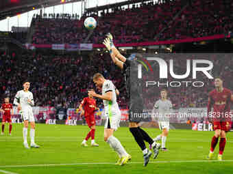 Kamil Grabara of VfL Wolfsburg  controls the ball during the Bundesliga match between RB Leipzig and VfL Wolfsburg at Red Bull Arena, Leipzi...