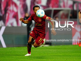 Lois Openda of RB Leipzig  controls the ball during the Bundesliga match between RB Leipzig and VfL Wolfsburg at Red Bull Arena, Leipzig, Ge...