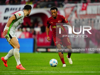 Lois Openda of RB Leipzig  controls the ball during the Bundesliga match between RB Leipzig and VfL Wolfsburg at Red Bull Arena, Leipzig, Ge...