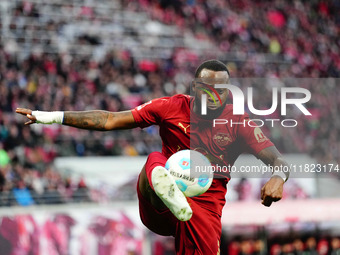 Lutsharel Geertruida of RB Leipzig  controls the ball during the Bundesliga match between RB Leipzig and VfL Wolfsburg at Red Bull Arena, Le...