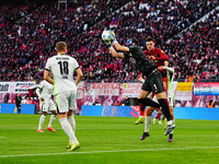 Kamil Grabara of VfL Wolfsburg  controls the ball during the Bundesliga match between RB Leipzig and VfL Wolfsburg at Red Bull Arena, Leipzi...