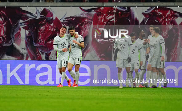 Joakim Maehle of VfL Wolfsburg  celebrates the teams fourth goal during the Bundesliga match between RB Leipzig and VfL Wolfsburg at Red Bul...